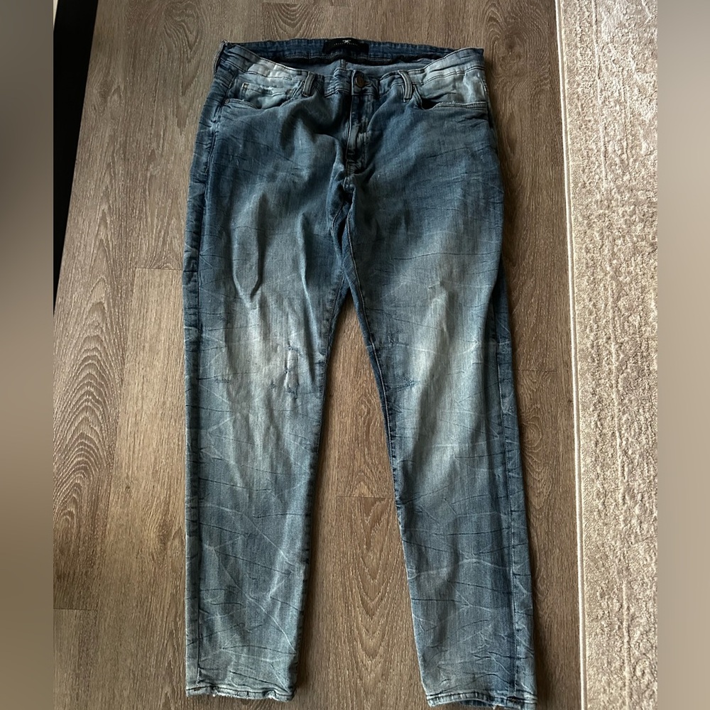 Jordan Blue Relaxed Jeans with Distressed Detailing